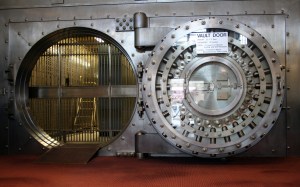 Large door to an old bank vault by jonathunder at http://en.wikipedia.org/wiki/Bank#mediaviewer/File:WinonaSavingsBankVault.JPG.