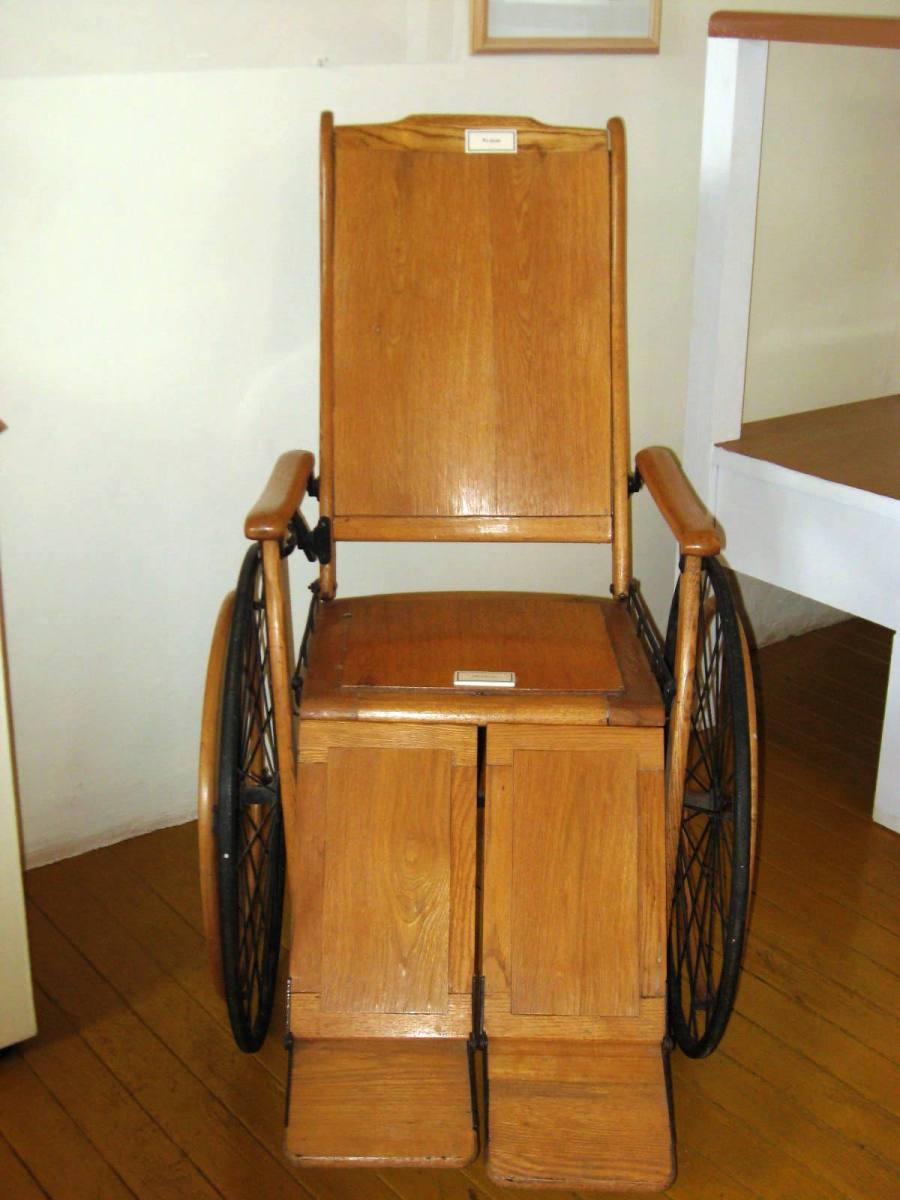 "WoodWheelchair" by Thelmadatter - Own work. Licensed under Public Domain via Wikimedia Commons - http://commons.wikimedia.org/wiki/File:WoodWheelchair.JPG#mediaviewer/File:WoodWheelchair.JPG